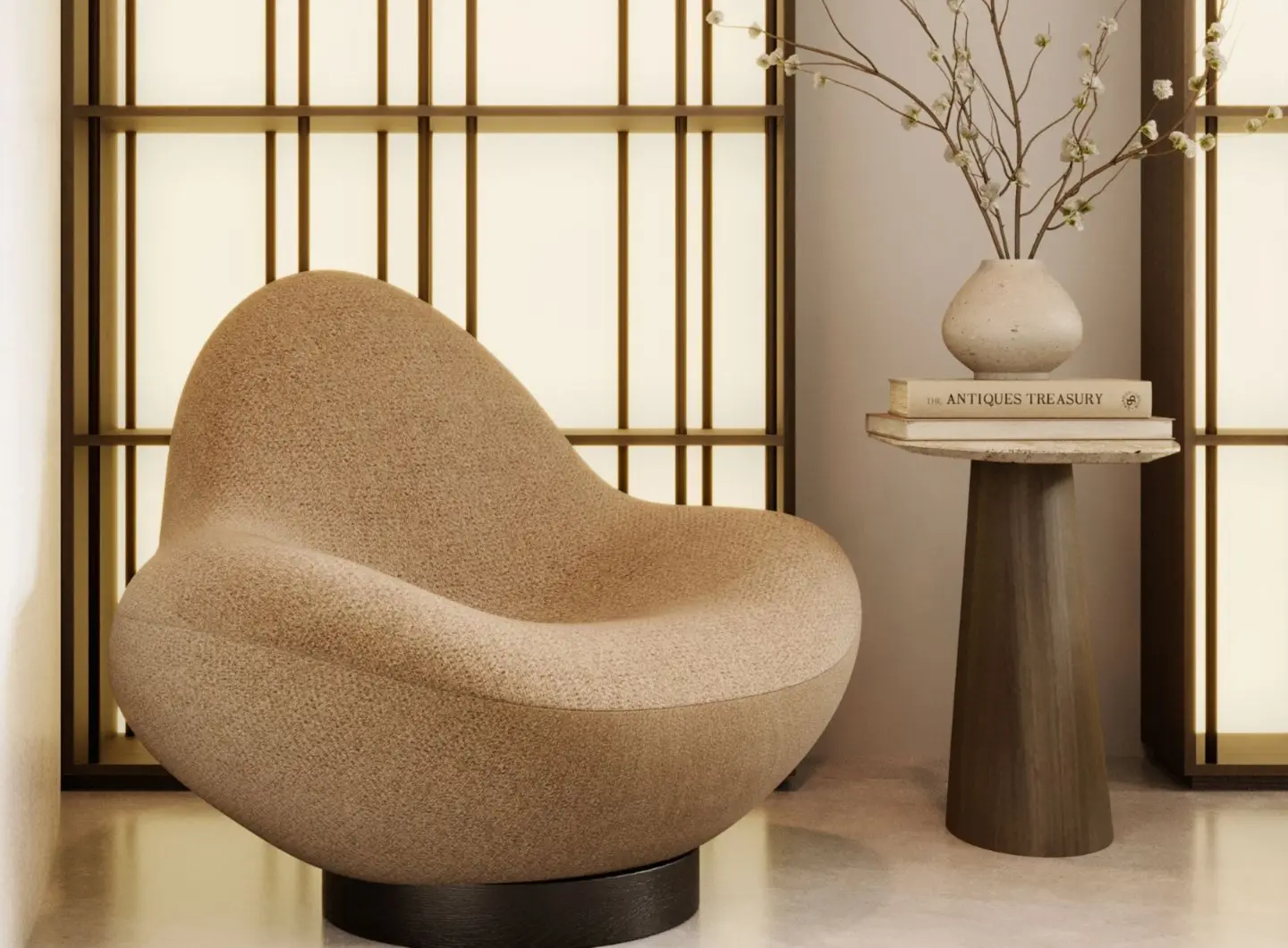 Un interno minimalista caratterizzato dalla scultorea poltrona Stone, rivestita in tessuto beige testurizzato, abbinata al tavolino Stone, su cui sono disposti un vaso e alcuni libri, creando un angolo tranquillo ed elegante che mette in risalto l'arredamento di lusso della casa.
