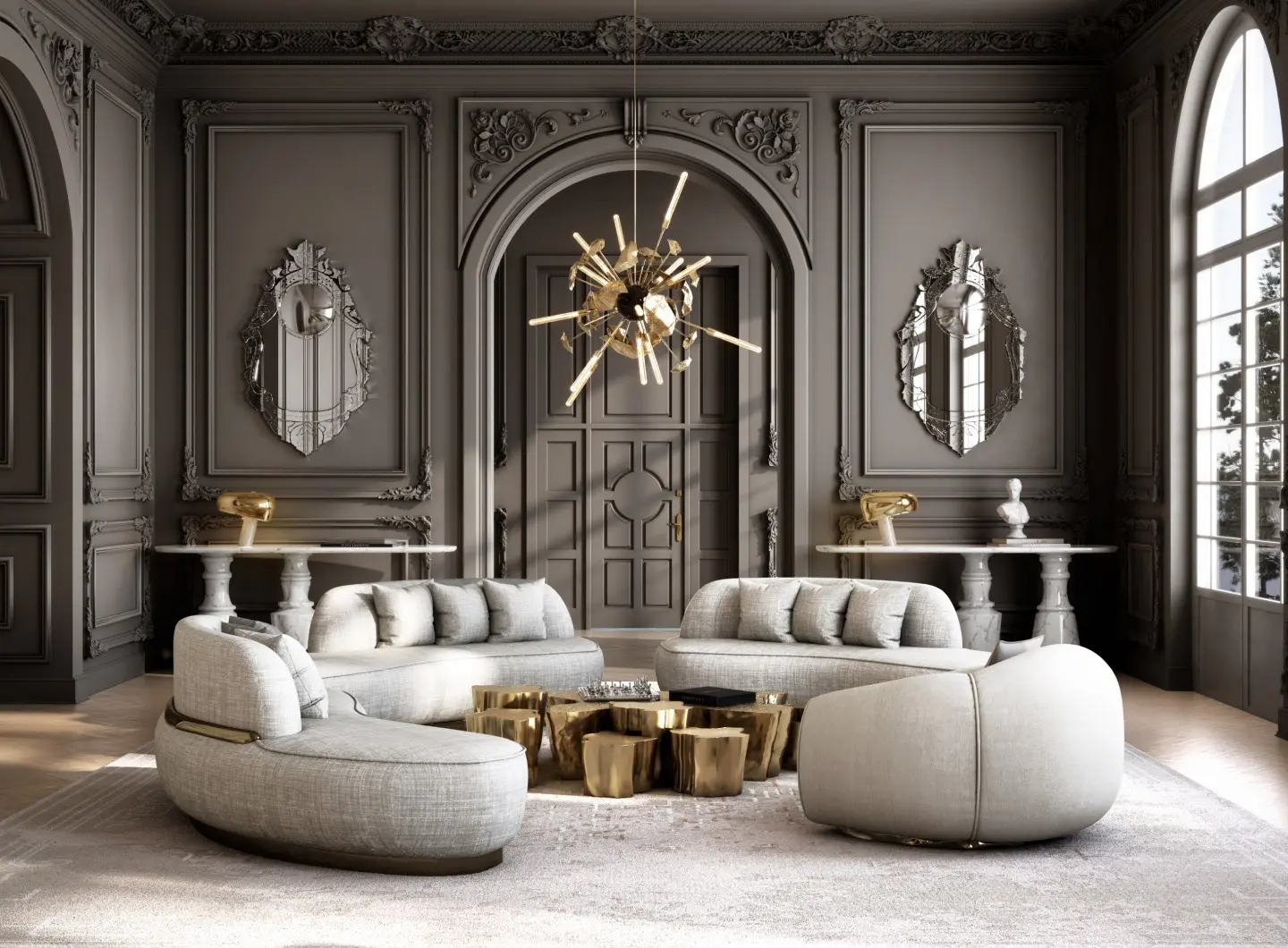 A luxurious contemporary living room by Boca do Lobo featuring the curved Odette Sofa and Soleil Armchair in neutral upholstery. At the center, the gold-leaf Eden Series center table sits beneath the sculptural Supernova Chandelier. The setting showcases dark grey walls with ornate classic moldings and large arched windows, blending modern furniture design with timeless luxury.