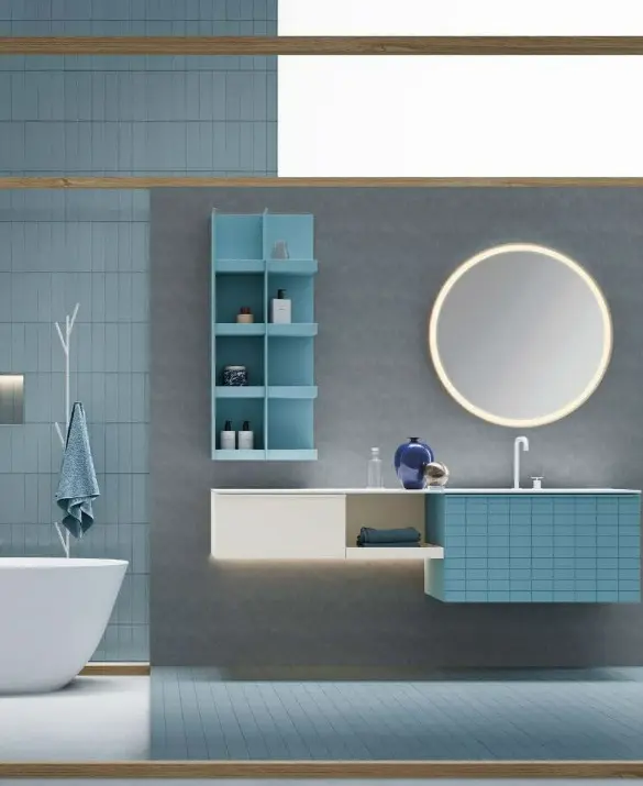 Bagno Bloom. Base portalavabo con anta Tile e maniglia Zig laccata turchese opaco, base a giorno e base laterale con anta liscia laccata platino opaco. Piano lavabo in Teknorit bianco opaco. Specchio tondo Bloom con telaio in metallo curvato laccato bianco opaco con LED perimetrali. Pensile a giorno laccato turchese opaco.